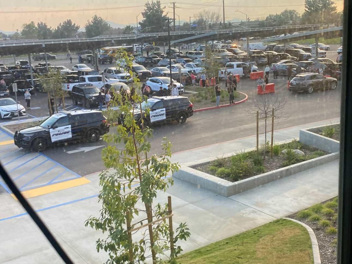 Parents wait outside for students to be released.

